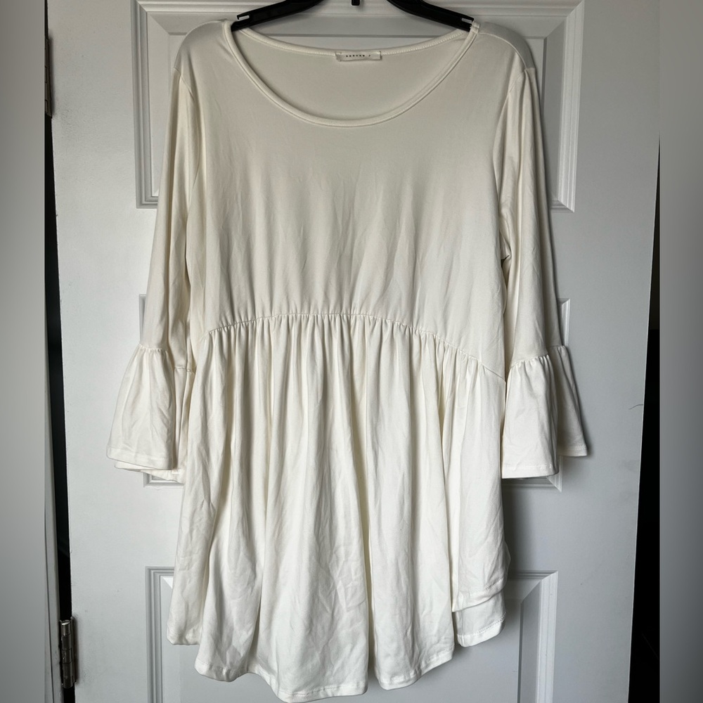 Super cute and flowy, white, half sleeve shirt.